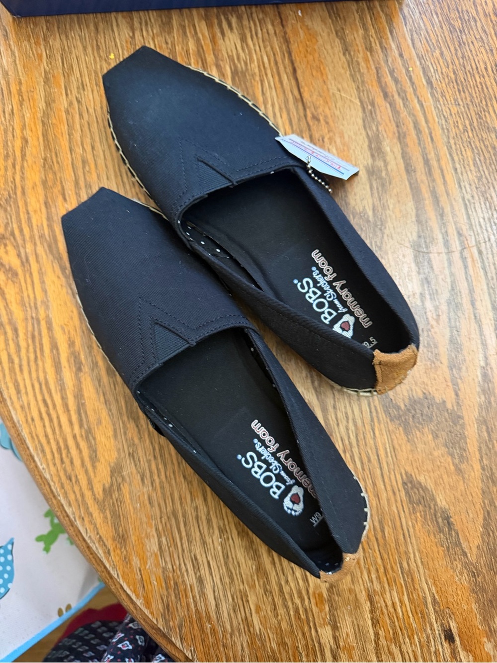 Skechers Black Canvas Slip-On Flats with Tan Heel Accent